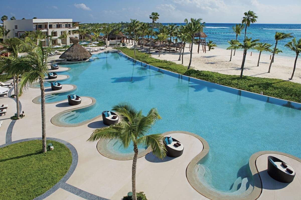 large pool area overlooking the beach Secrets Mexico Akumal Riviera Maya