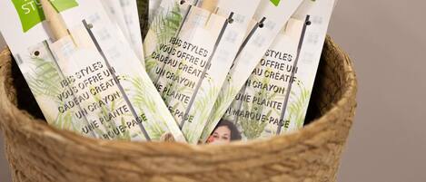 A basket filled with brochures labeled 'Ibis Styles.'