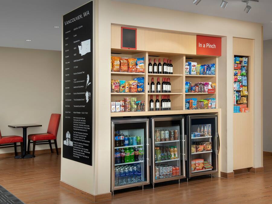 A vending machine area with snacks, drinks, and a sign reading "In a Pinch".