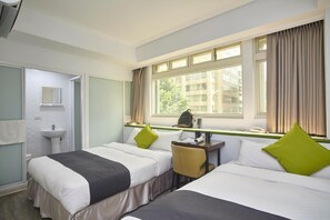 A hotel room with two beds, a desk, a chair, a window with curtains, a sink, and a mirror. - TO Hotel Chengde (Taipei)