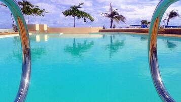 Outdoor pool, pool umbrellas, sun loungers