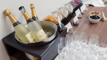 A bar area with champagne bottles and glasses.