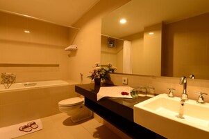 Executive Suite | Bathroom | Shower, hair dryer (on request), towels