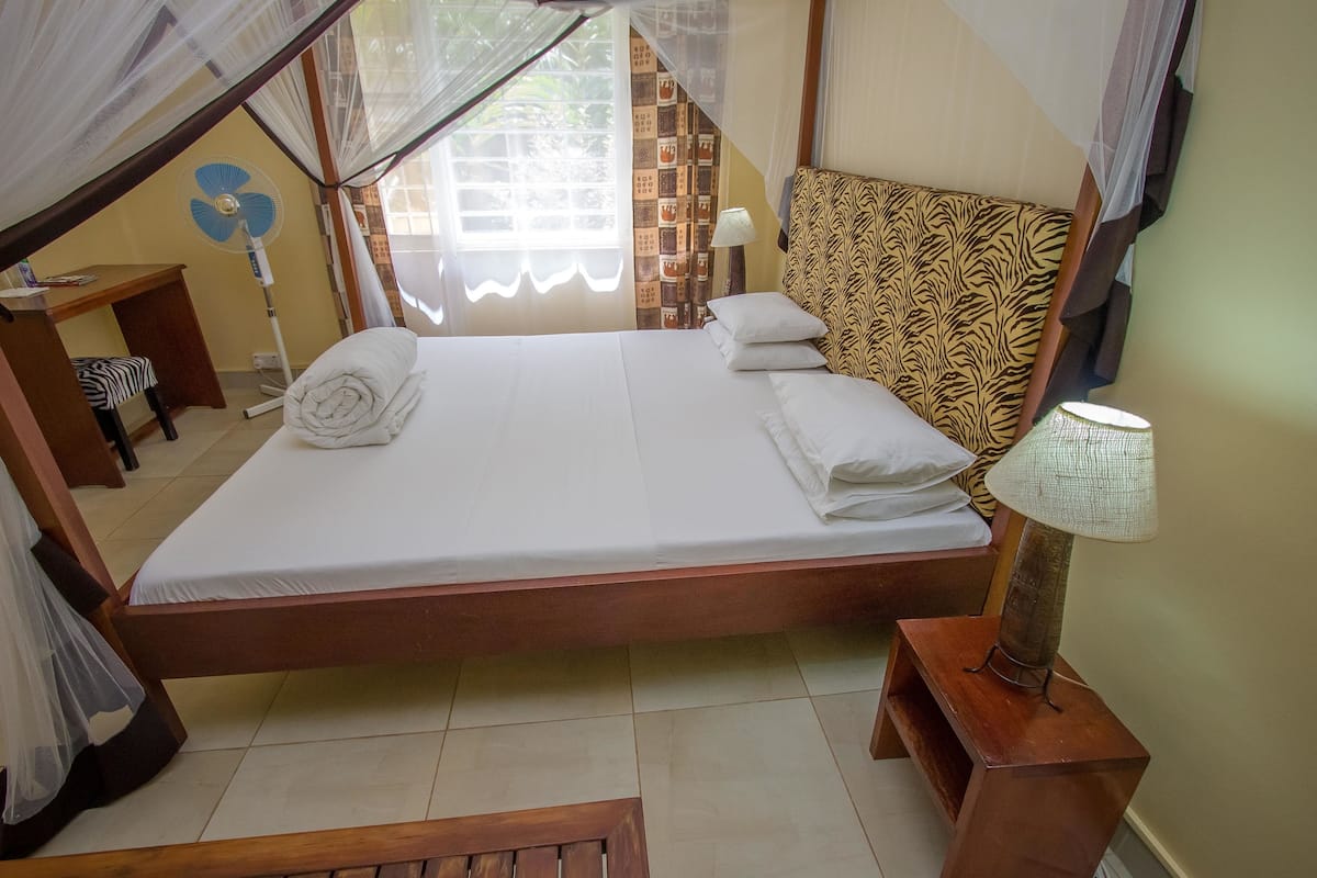 deluxe double room, pool view | in-room safe, desk, free wifi, bed sheets