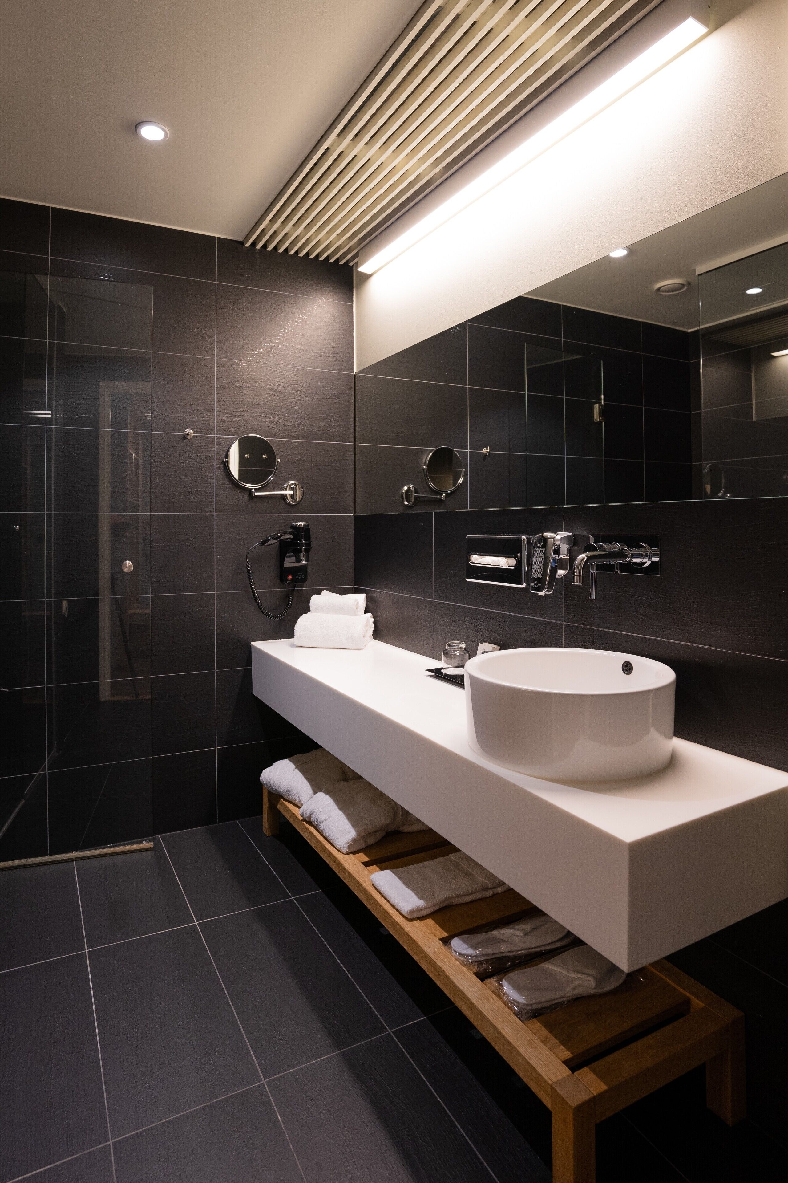 shower, hair dryer, bathrobes, slippers