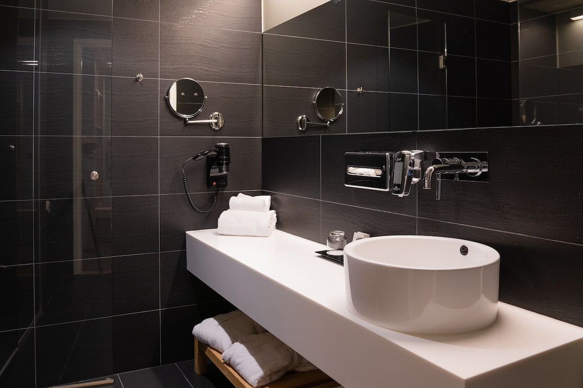 shower, hair dryer, bathrobes, slippers