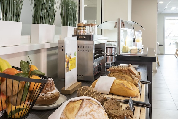 Daily buffet breakfast (EUR 18 per person)