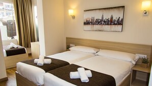 A hotel room with two beds, a cityscape painting, and a window with curtains. - Hostal Barcelona Travel (Barcelona)