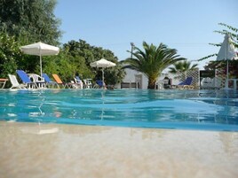 Seasonal outdoor pool, pool umbrellas