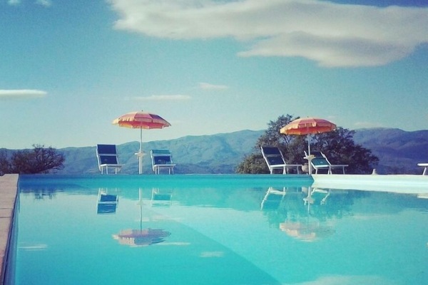 Seasonal outdoor pool, open 8:00 AM to 8:00 PM, pool umbrellas