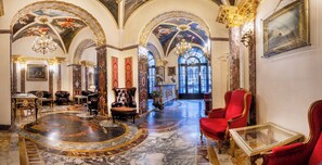 A luxurious interior with marble floors, ornate furniture, and high ceilings with frescoes. - Des Epoques Hotel (Rome)