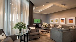 Penthouse | Living area | 37-inch LCD TV with satellite channels, TV