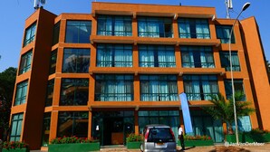 A modern multi-story building with large windows and a flat roof. - Gorillas City Centre Hotel (Kigali)