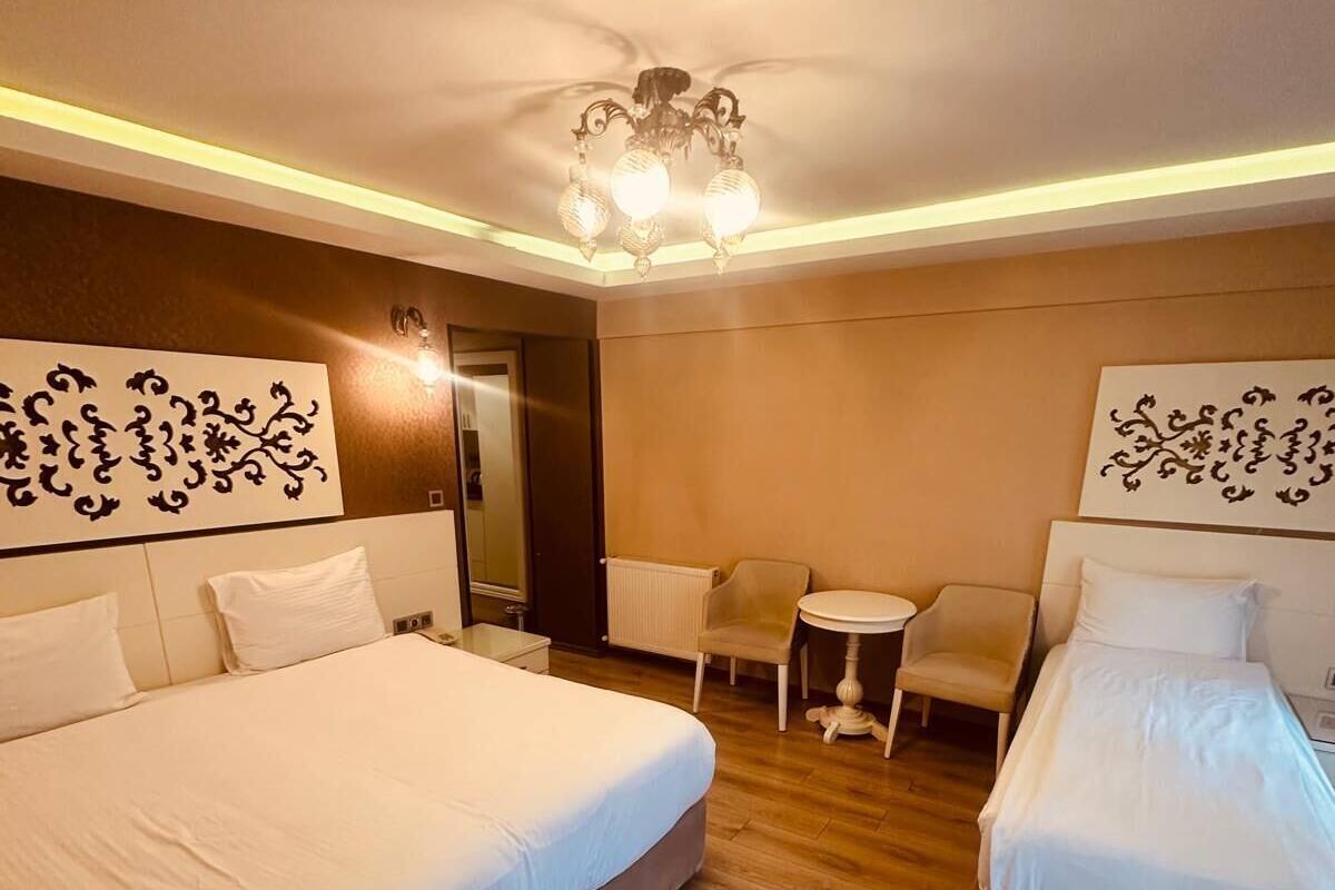 Superior Triple Room | Minibar, in-room safe, desk, soundproofing