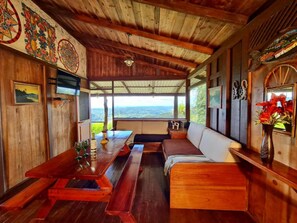 Villa Chingolotea | Living area | 32-inch TV with cable channels - Santa Juana Lodge and Nature Reserve (Naranjito)