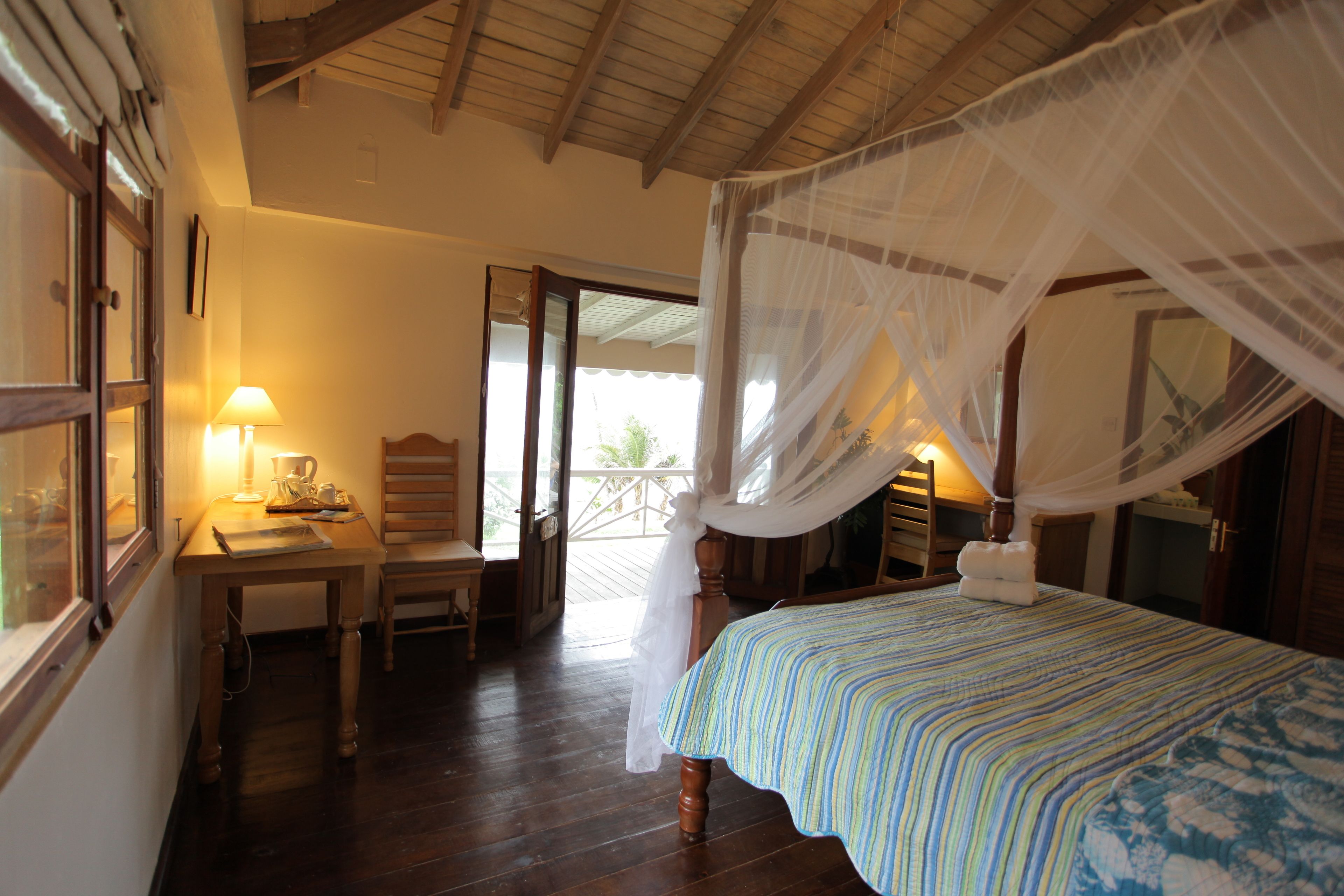romantic double room, 1 queen bed, balcony, beachfront | premium bedding, in-room safe, desk, free cots/infant beds