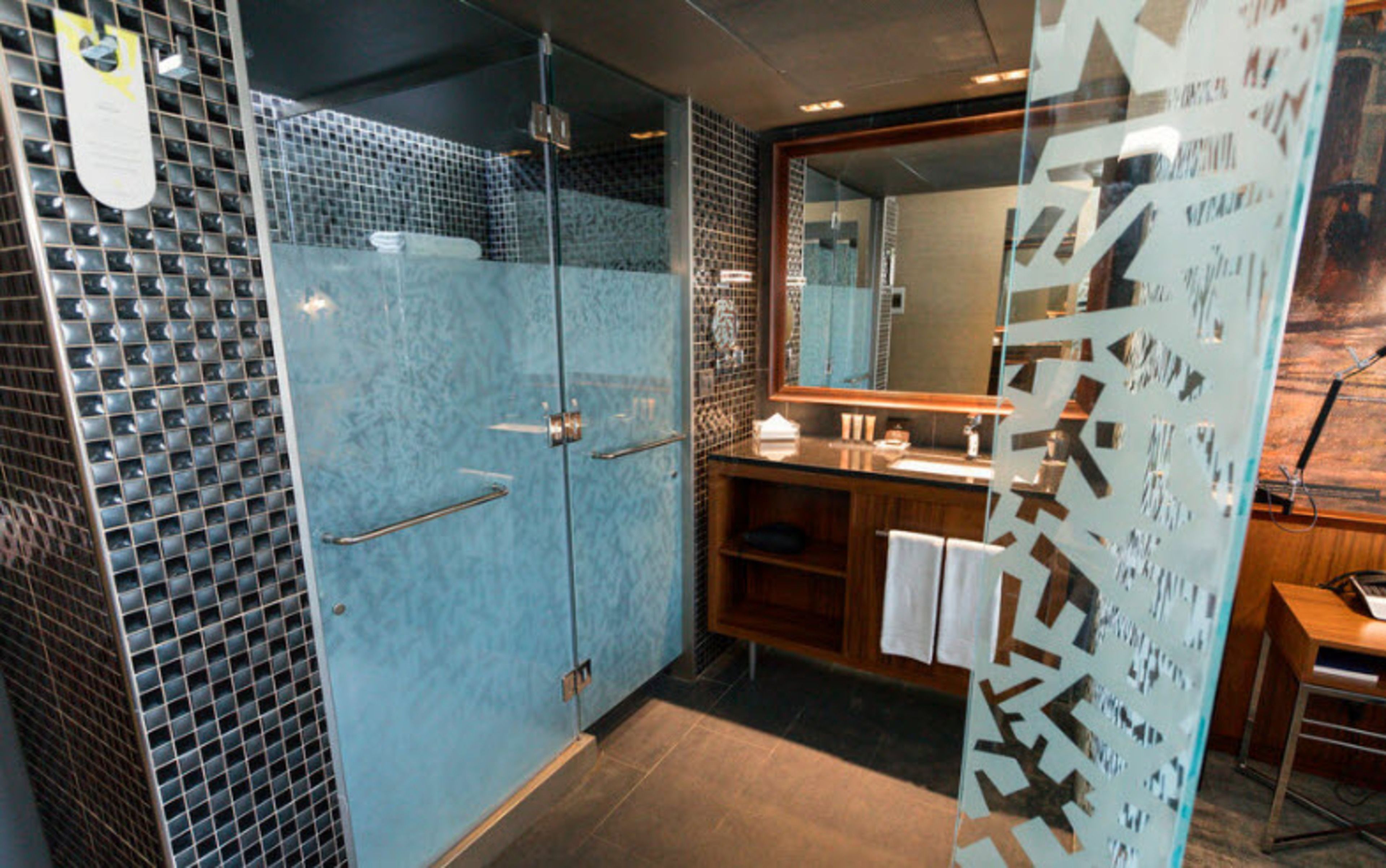 shower, hair dryer, slippers, towels