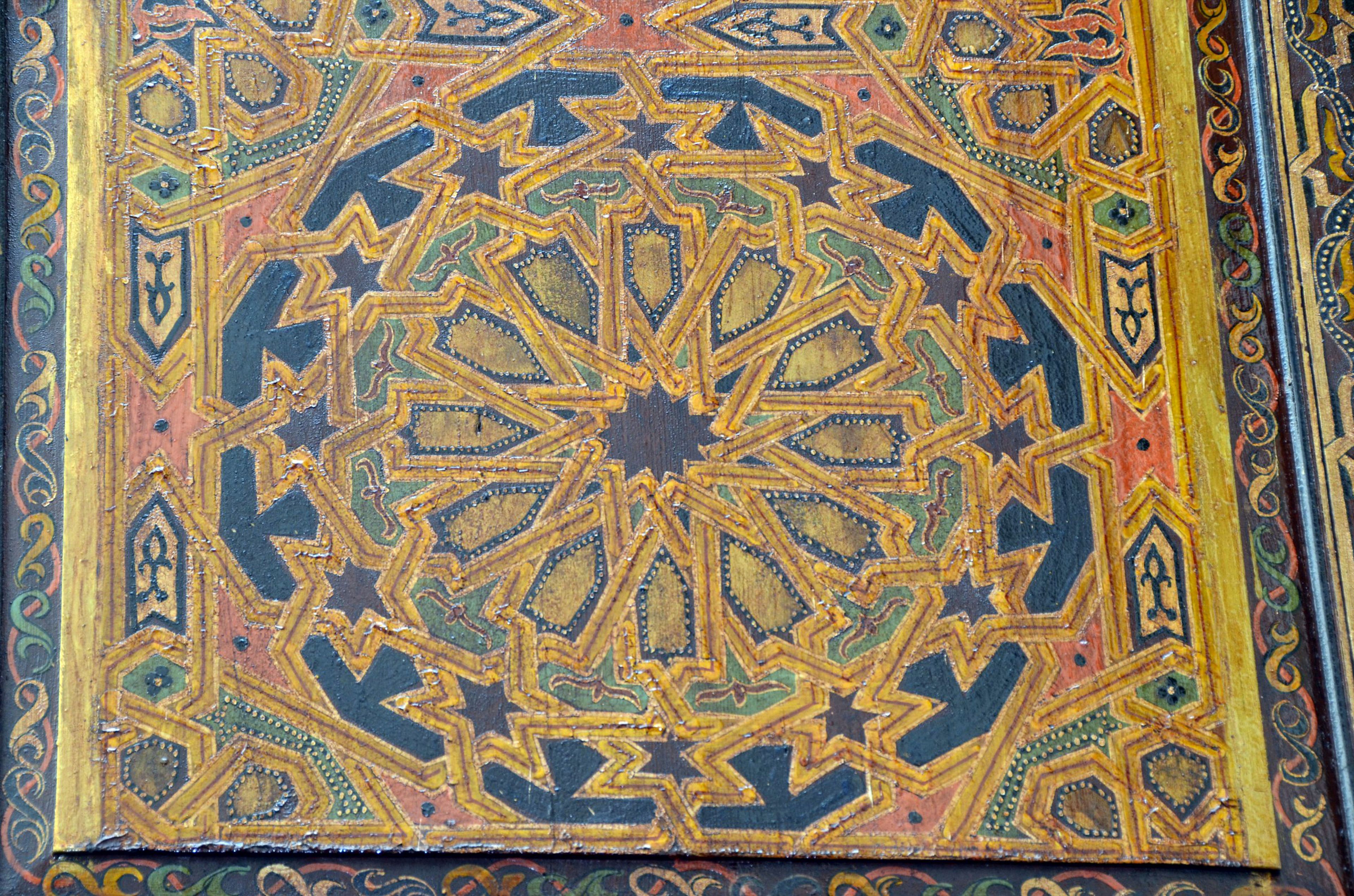 A detailed geometric pattern on a surface.