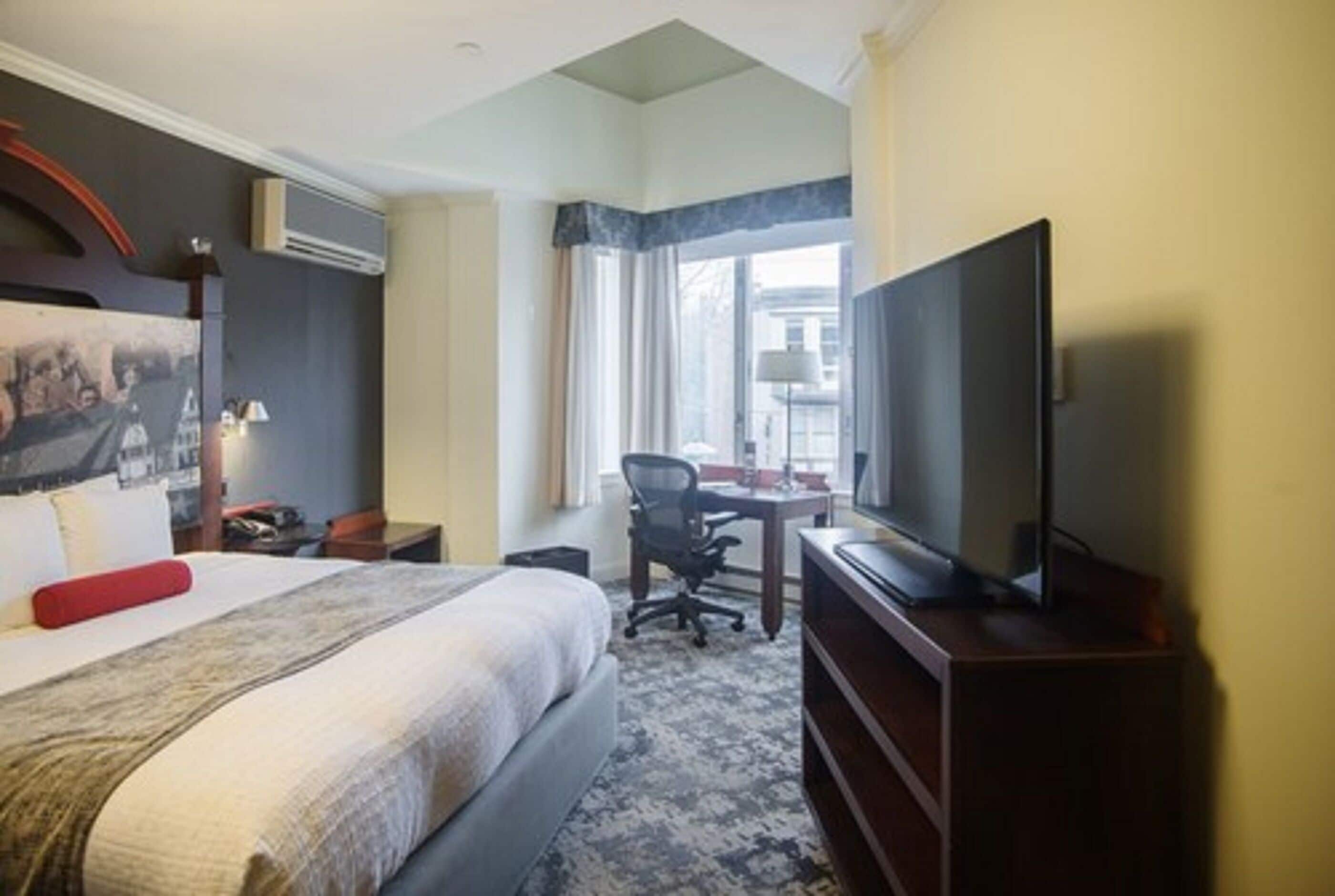 signature suite, 1 king bed with sofa bed | in-room safe, desk, laptop workspace, iron/ironing board