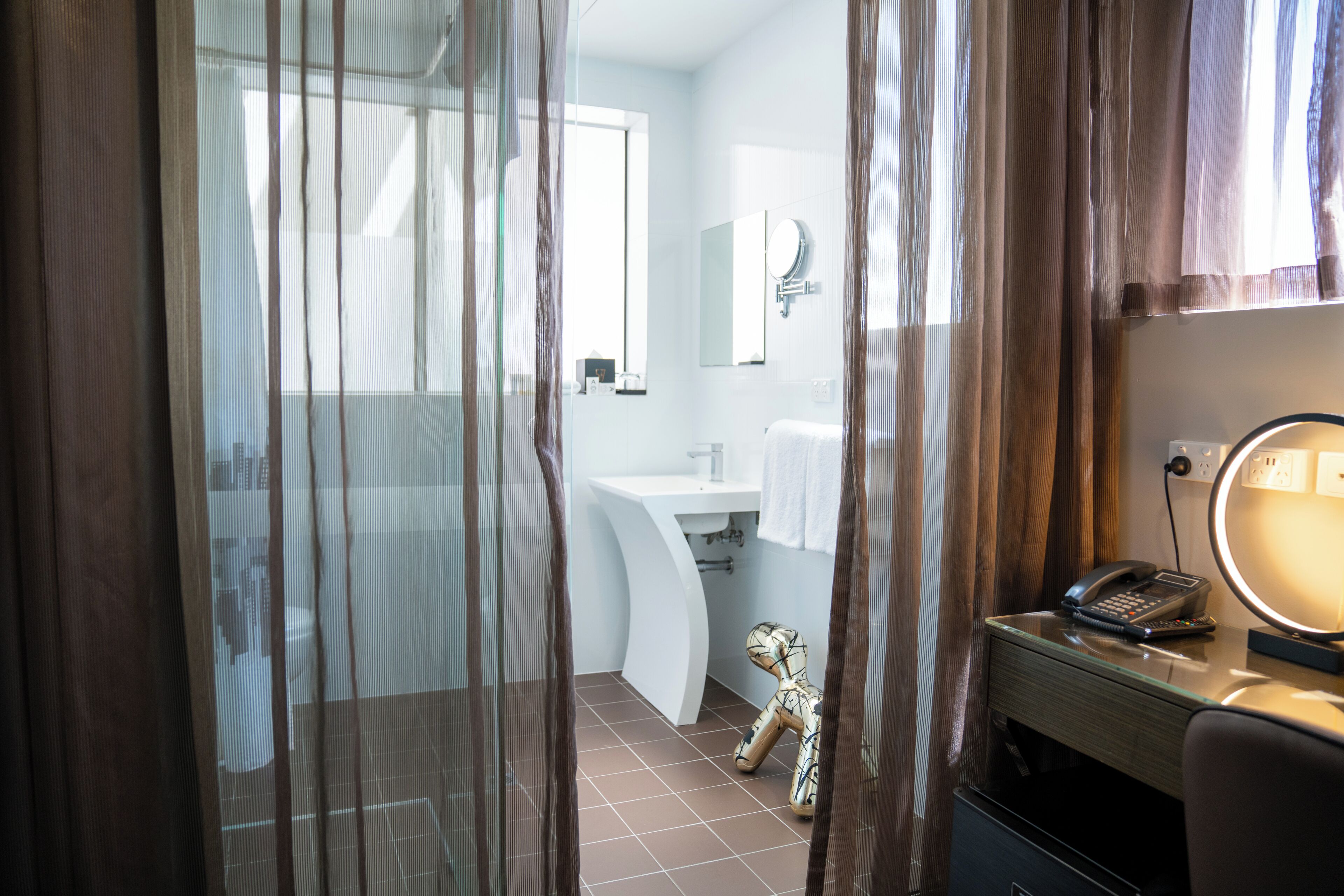 shower, designer toiletries, hair dryer, towels