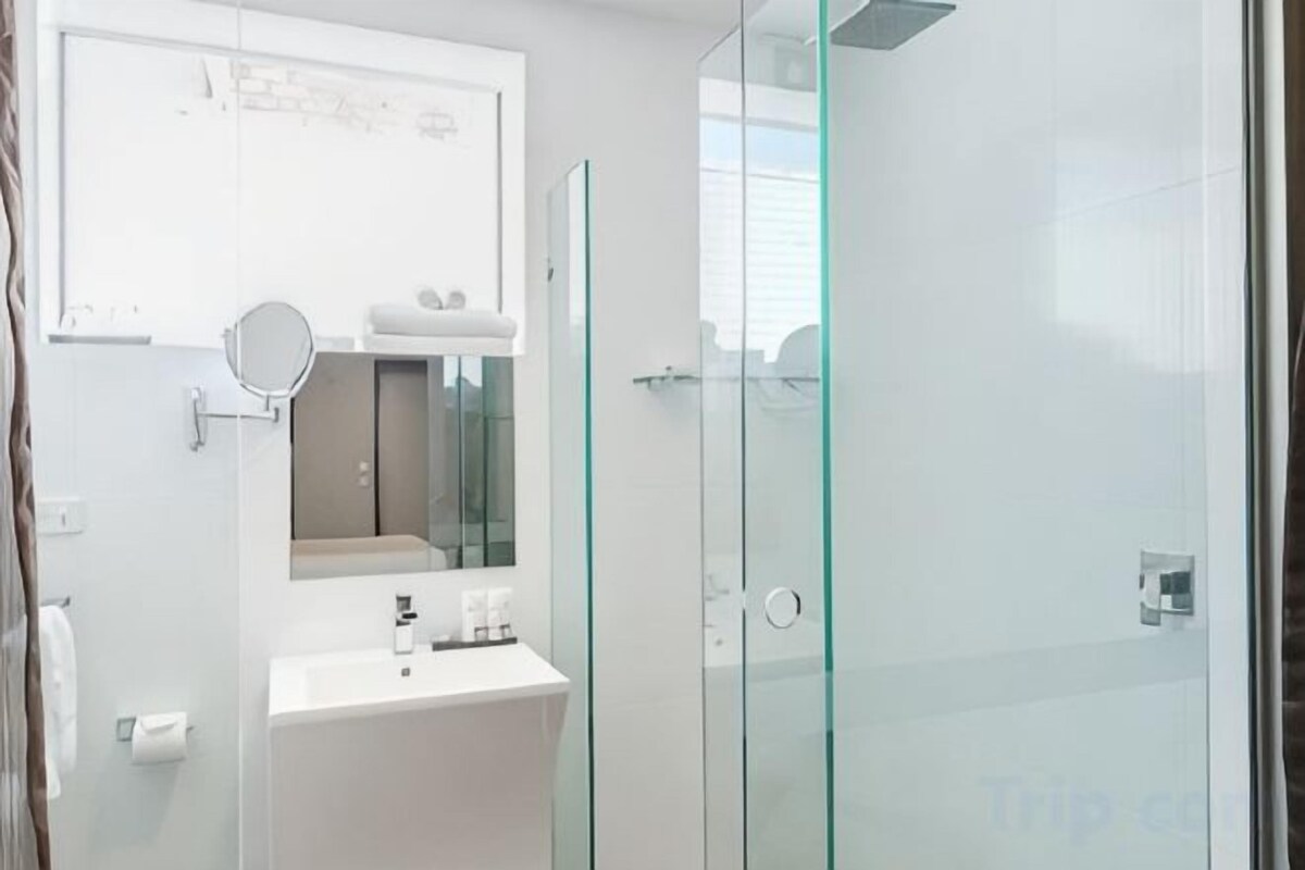 Bathroom | Shower, designer toiletries, hair dryer, towels