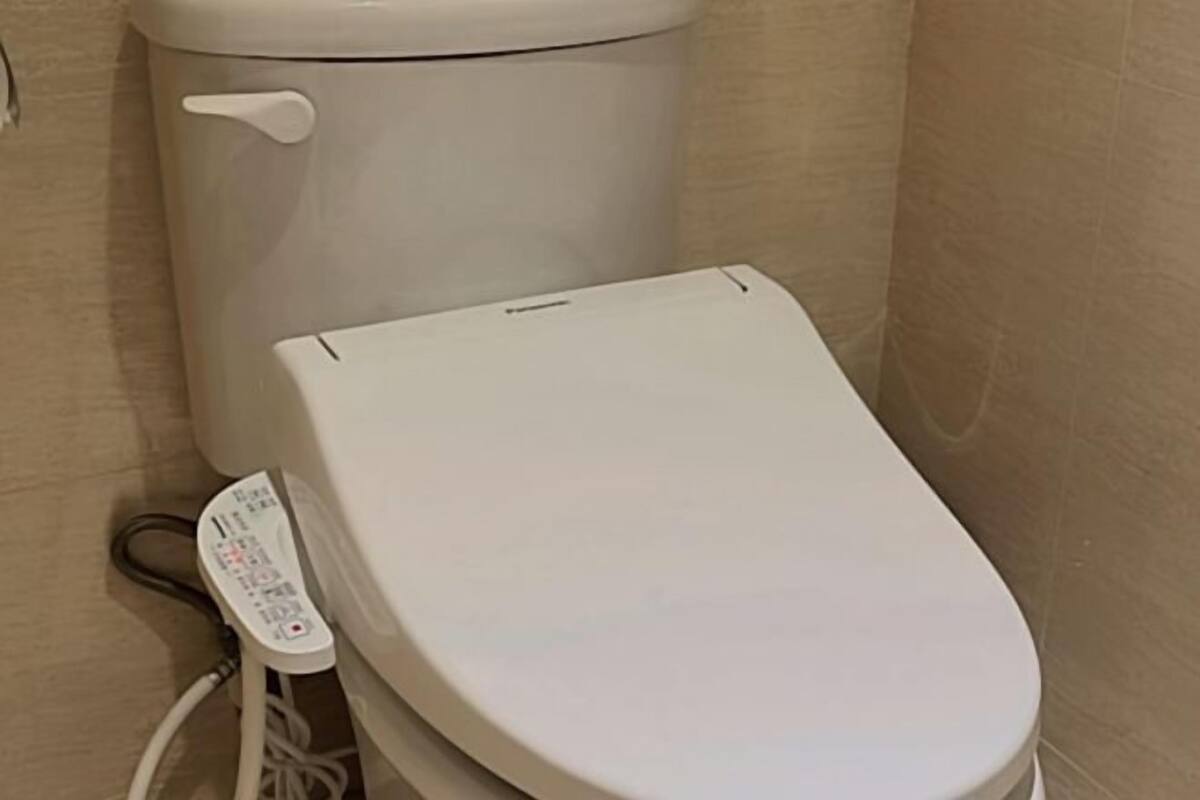 Shower, hair dryer, slippers, towels