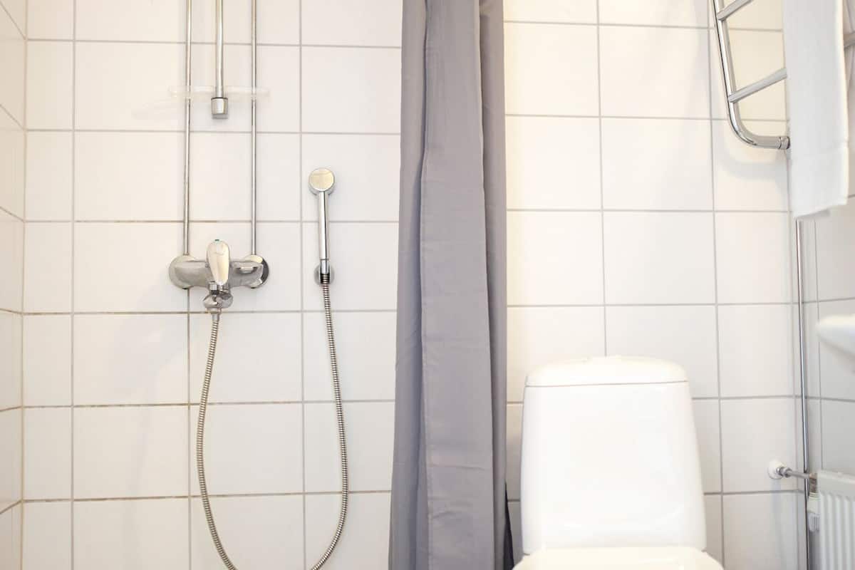 studio | bathroom | shower, hair dryer, towels, soap