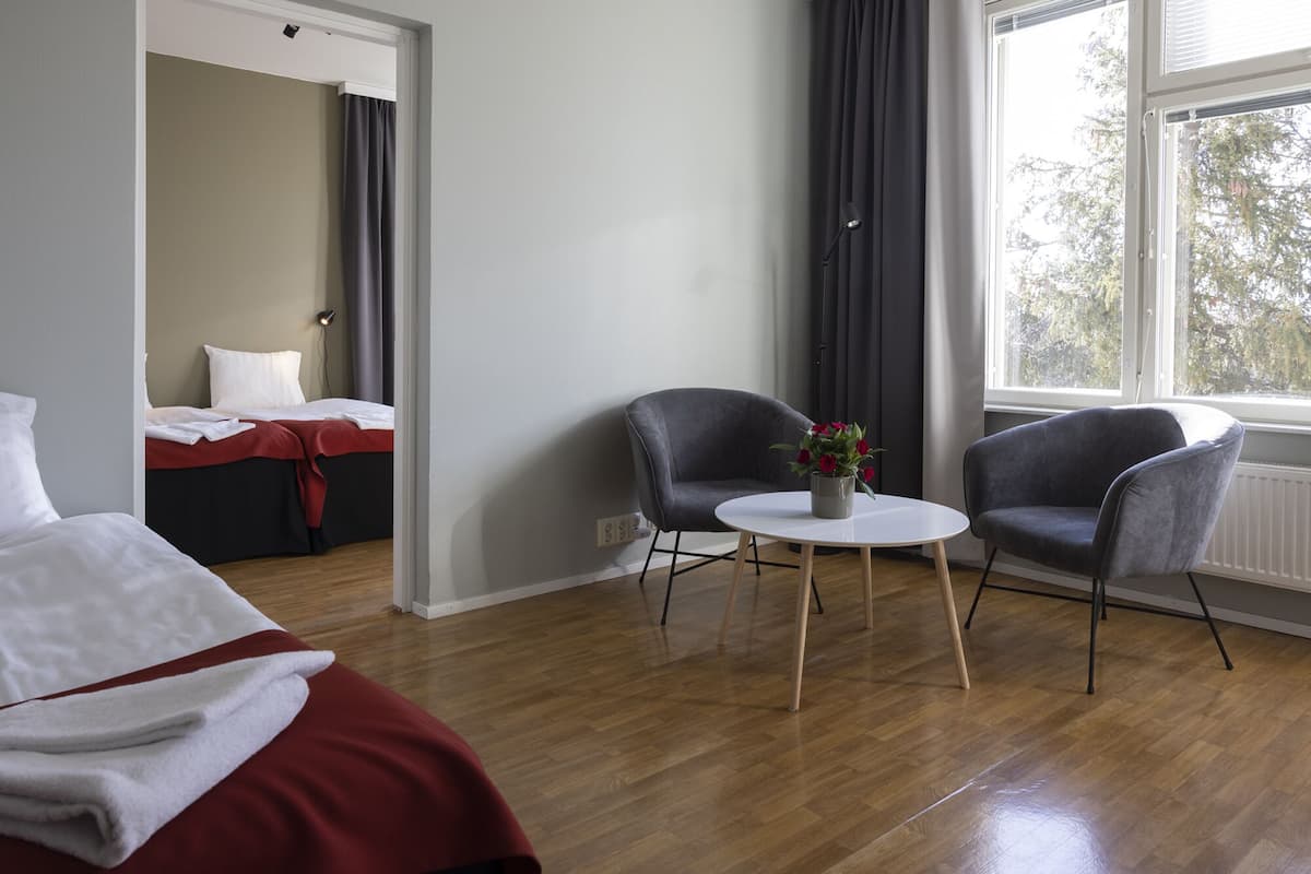 standard apartment | living area | 32-inch tv with cable channels, ping pong, books