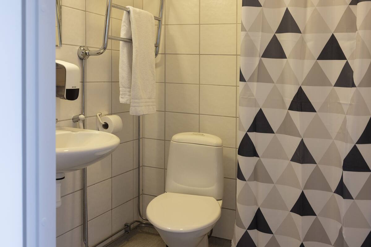 standard apartment | bathroom | shower, hair dryer, towels, soap