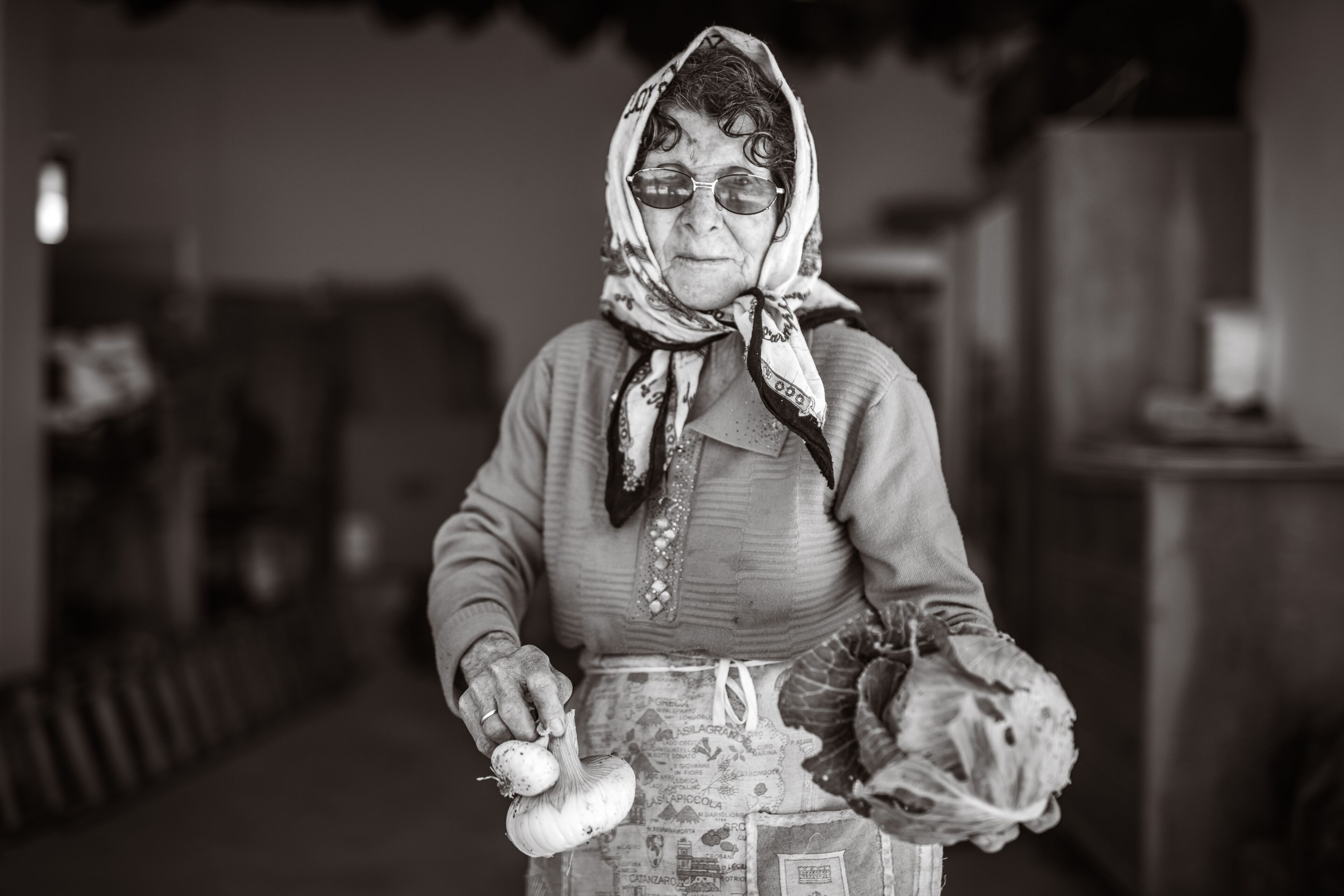 A person holding a bulb and a headscarf.