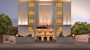 A modern hotel with a flat roof, large windows, and a sign indicating it is located in Bani Park, Jaipur. - Zone by The Park Bani Park Jaipur (Jaipur)