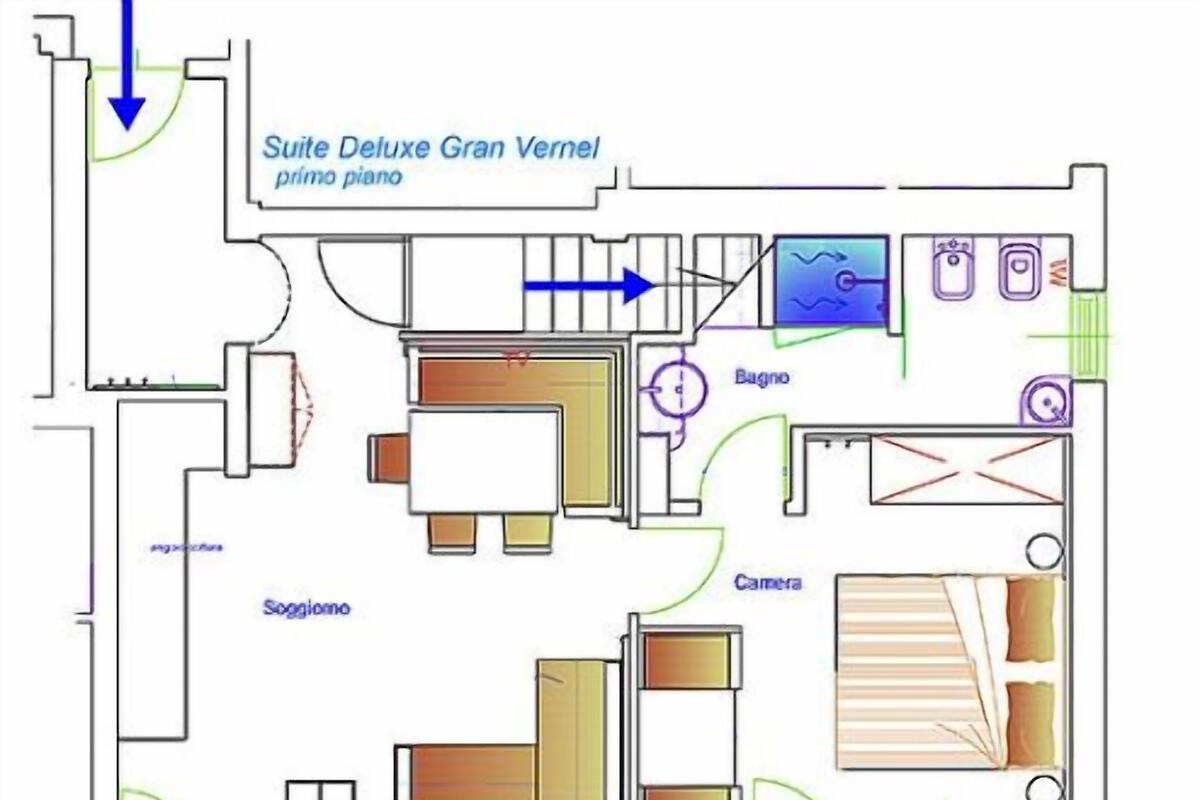 A floor plan of a hotel with a 'Suite Deluxe Gran Verne' labeled as the primary piano, a 'Baggio' room, a 'Camera', and a 'Soggiorno' (sleeping area).