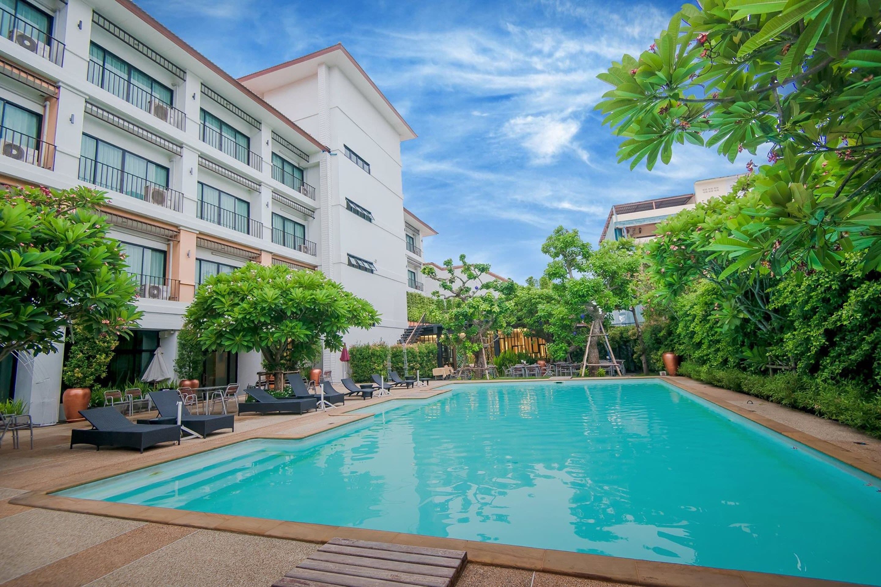 outdoor pool, pool umbrellas, pool loungers