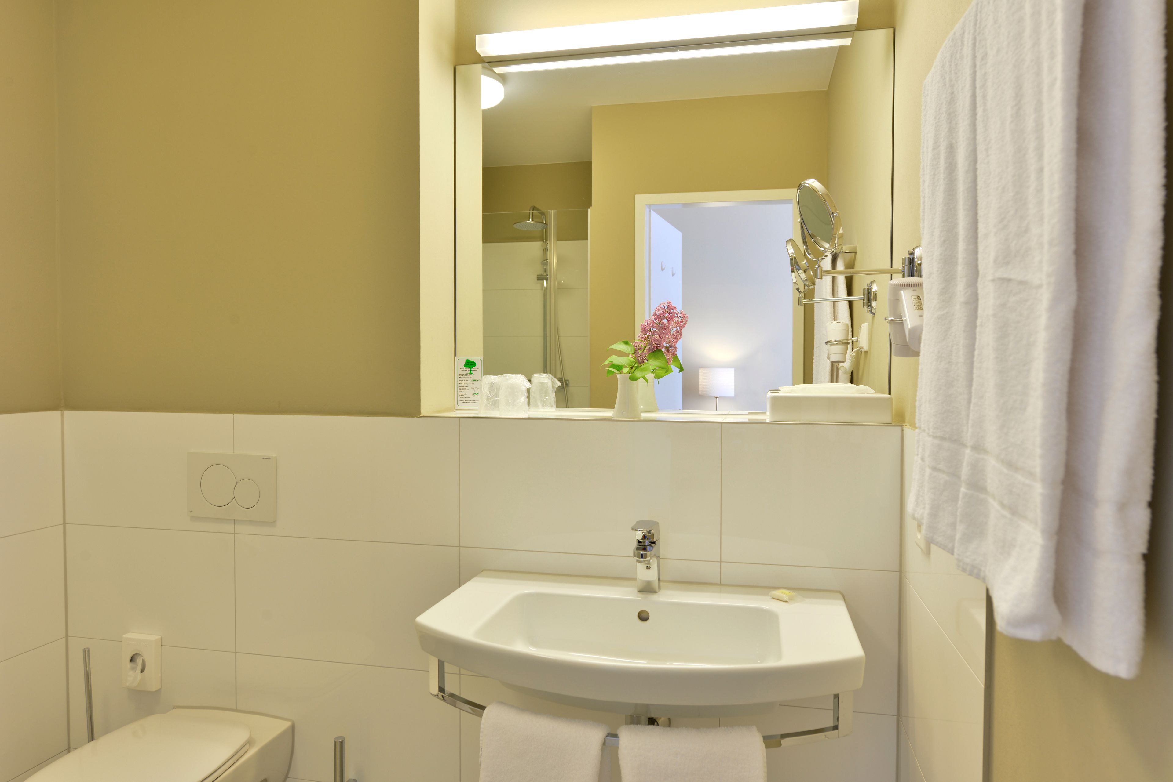 shower, rainfall showerhead, hair dryer, towels