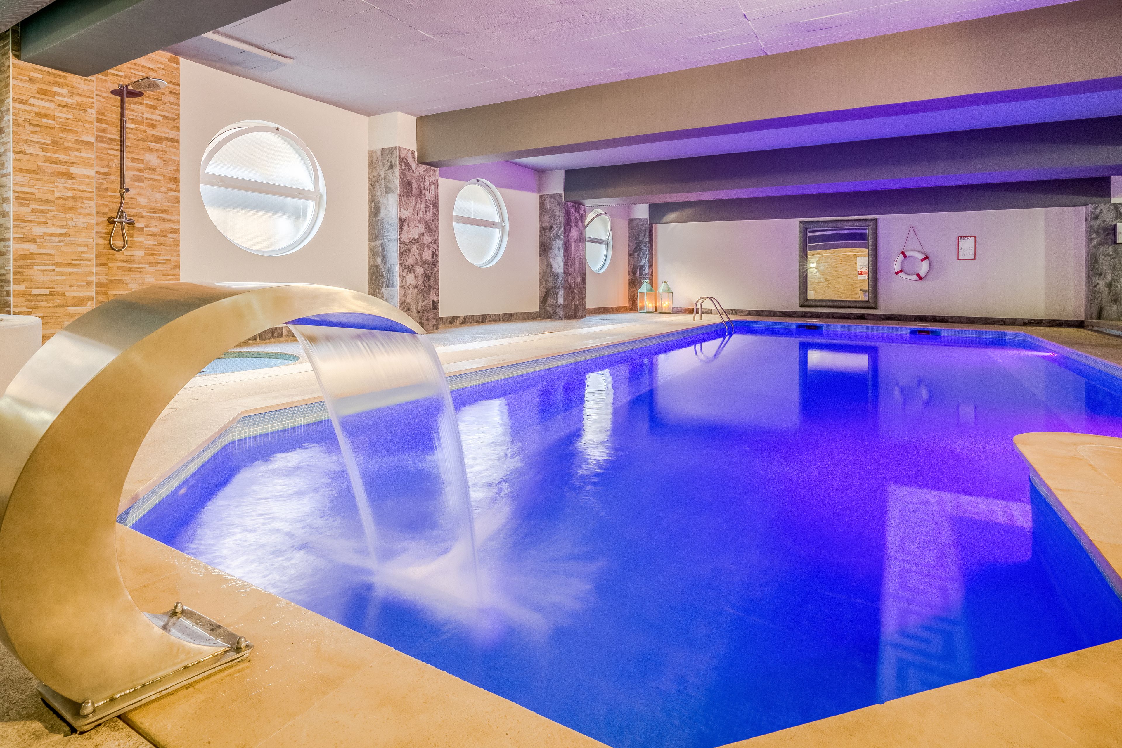 Indoor pool, seasonal outdoor pool, pool umbrellas, pool loungers