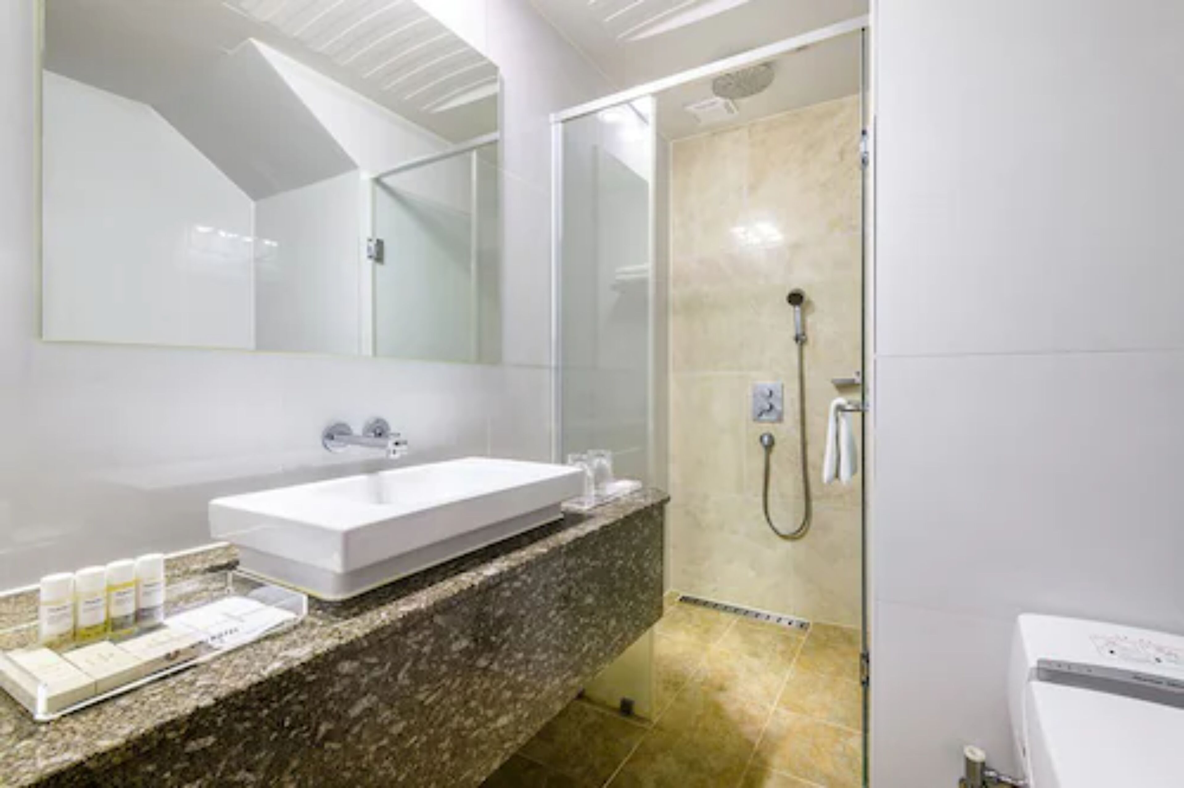 hair dryer, slippers, bidet, heated floors