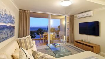 Apartment, 2 Bedrooms | Living room | 60-inch flat-screen TV with satellite channels, TV
