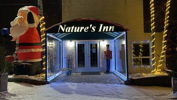 Welcome to Nature's Inn, where a clear sign above the door invites you in.