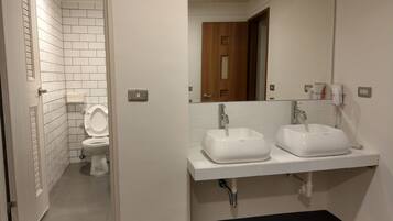 Shower, free toiletries, hair dryer, slippers