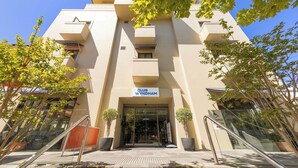 A modern building with a sign reading "CLUB WYNDHAM" at the entrance. - Club Wyndham Perth, Trademark Collection by Wyndham (West Perth)