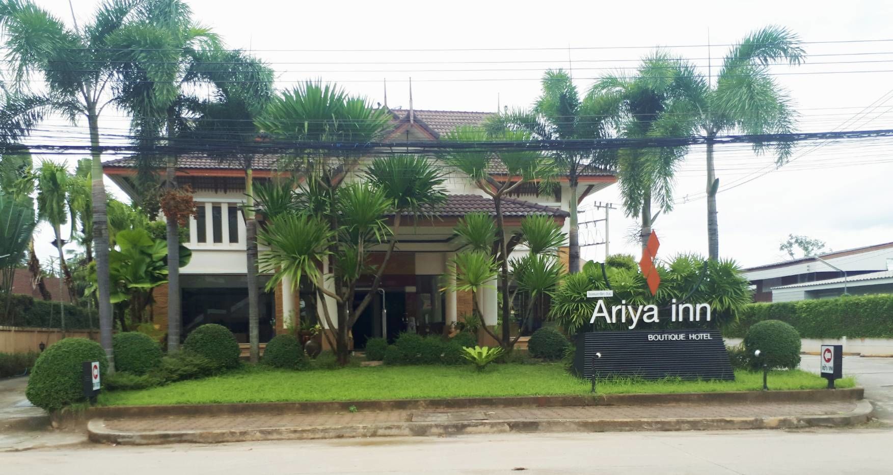 A hotel named "Ariya inn" with a sign indicating it's a boutique hotel.