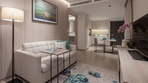 Un salón moderno con un sofá, una mesa de centro, una lámpara y un cuadro en la pared.