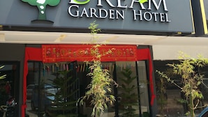 A hotel sign with a tree logo and the name "Dream Garden Hotel". - Dream Garden Hotel (Klang)