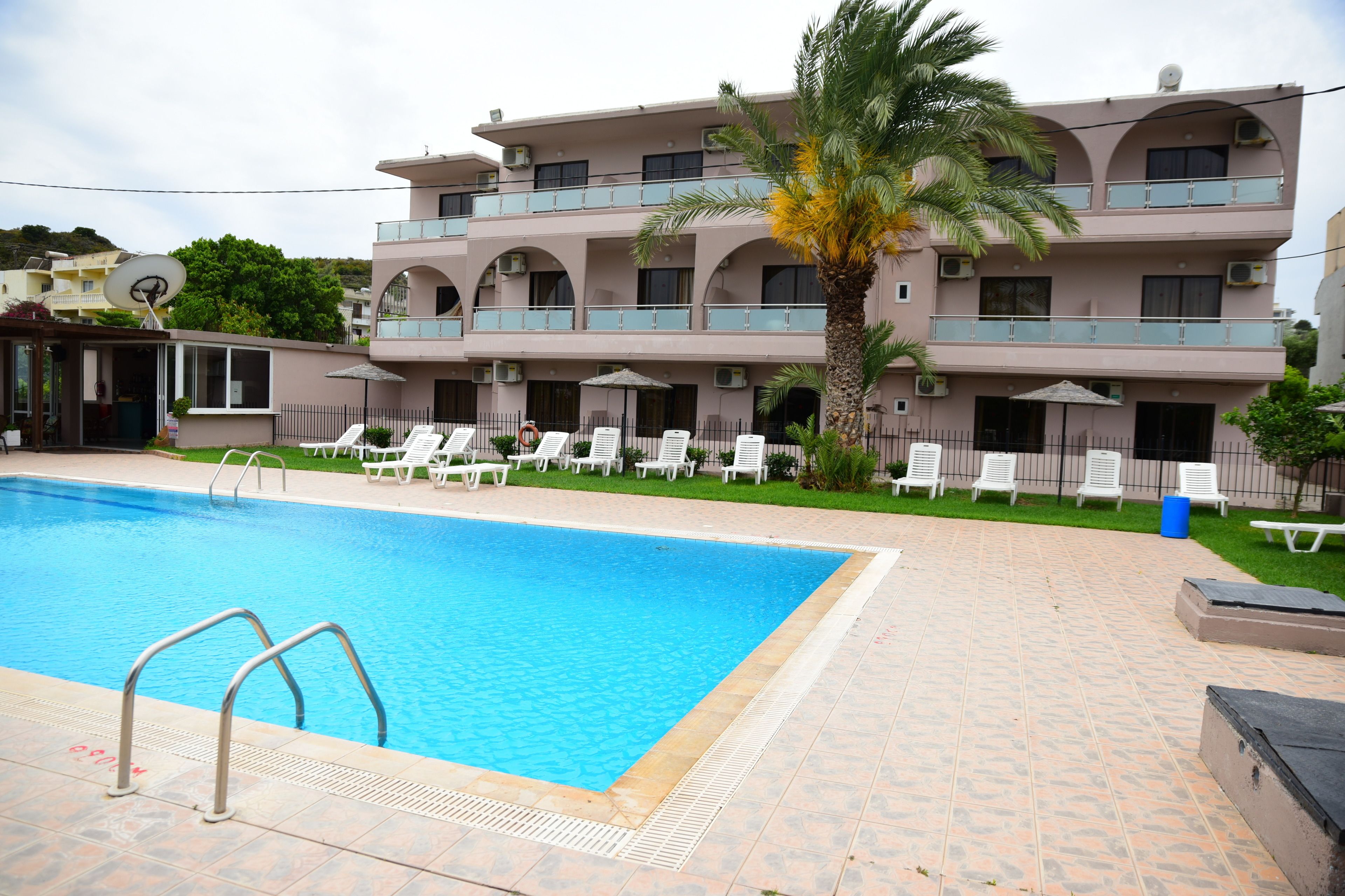 seasonal outdoor pool, pool umbrellas, pool loungers