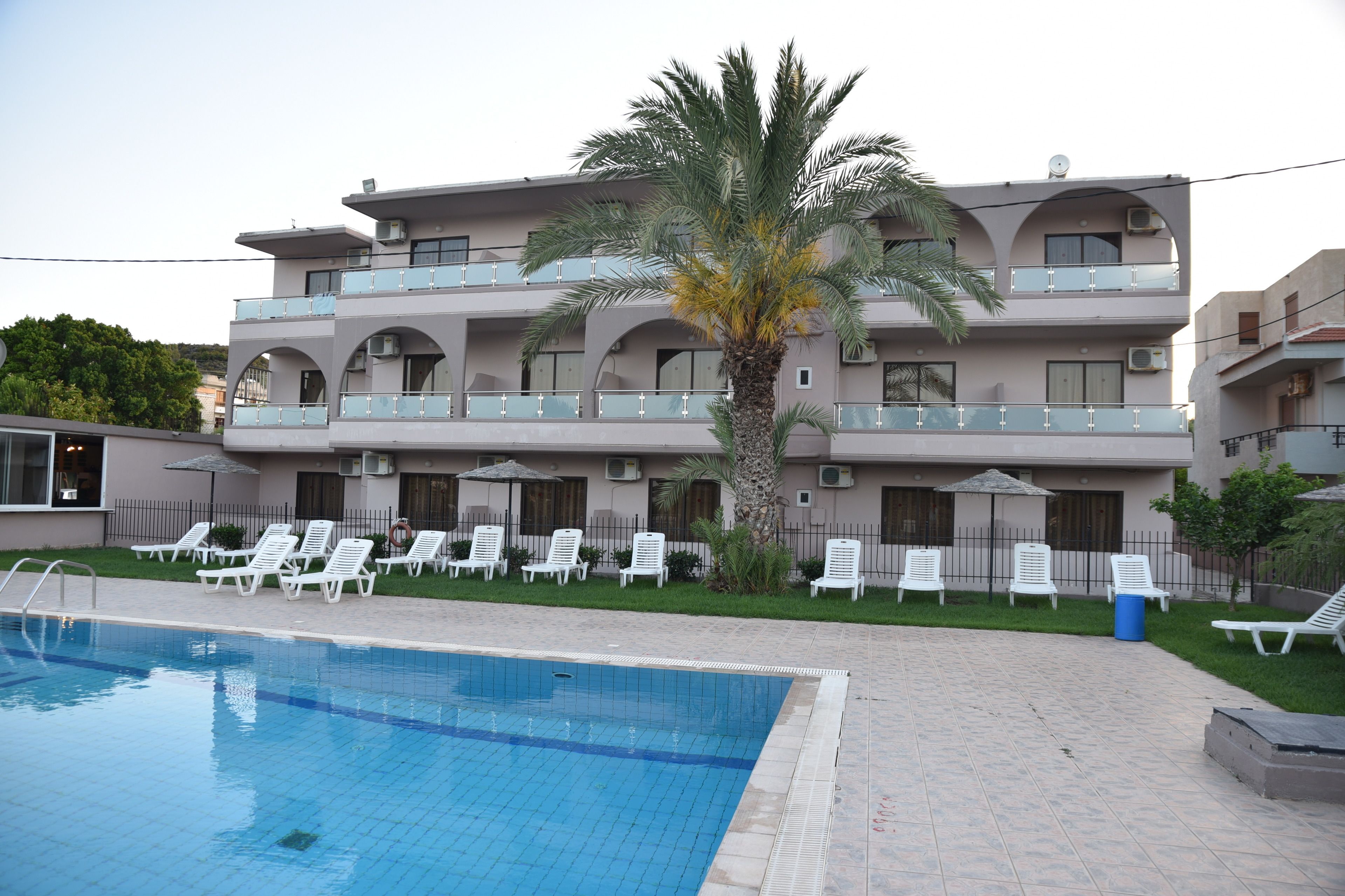 seasonal outdoor pool, pool umbrellas, pool loungers