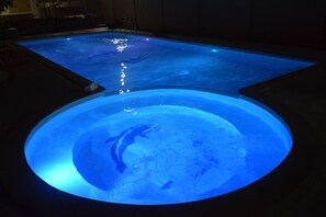 A swimming pool with a circular viewing area and a rectangular pool section. - WEStay @ The Grand Nyaung Shwe, Inle Lake (Nyaungshwe)