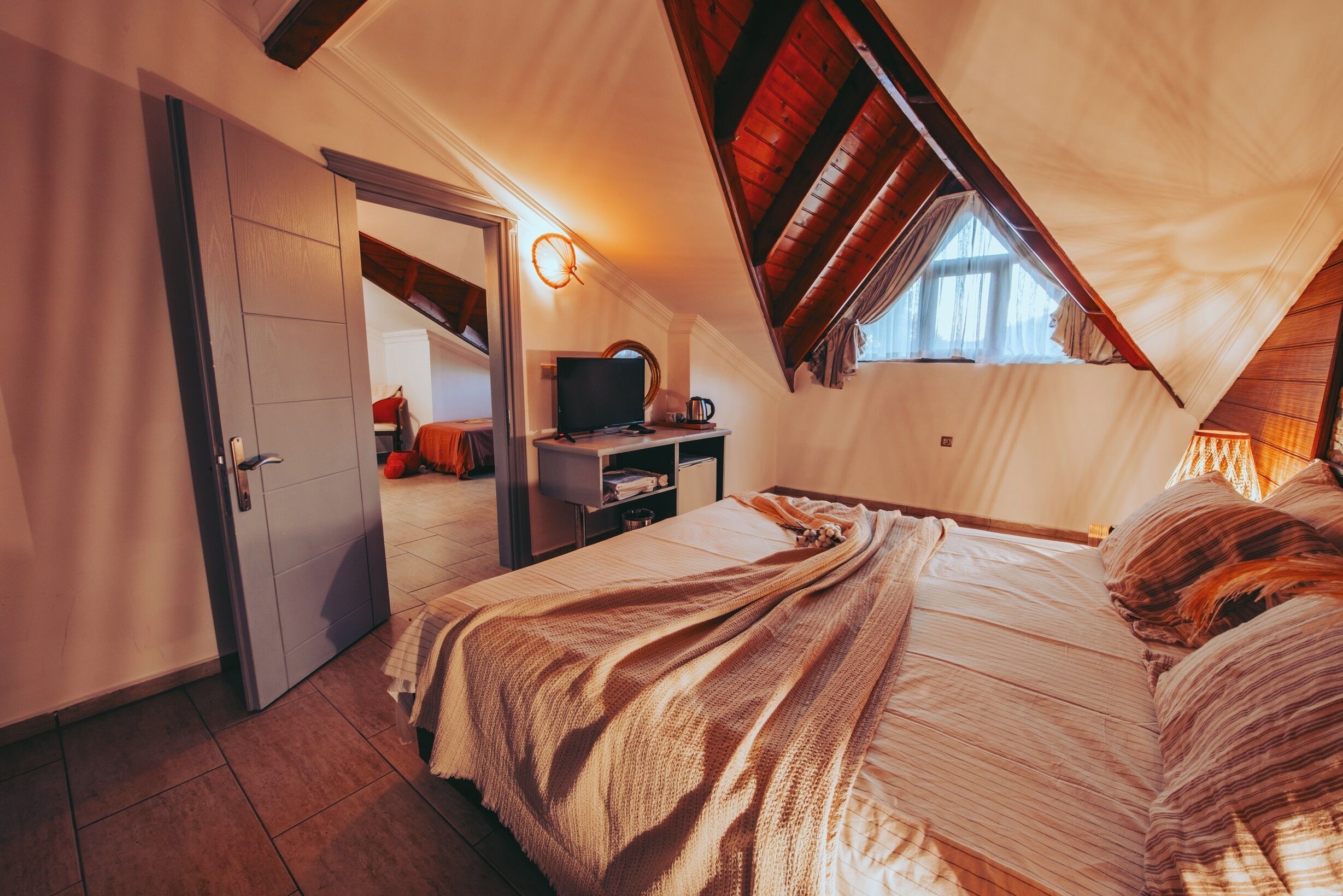 family room, 2 bedrooms | 1 bedroom, premium bedding, minibar, in-room safe