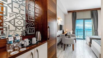 Standard Triple Room | Living area | Flat-screen TV