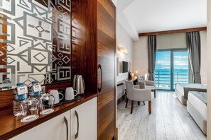 Standard Triple Room | Living area | Flat-screen TV