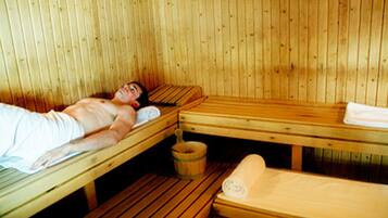 Relax in a serene sauna with a towel at hand.